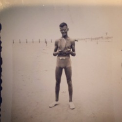 Dad, with paddle board, long before he became a dad. Circa 1935?